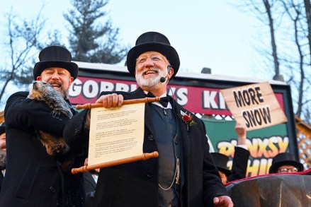 Groundhog Club handler A.J. Dereume holds Punxsutawney Phil, the weather prognosticating groundhog, as Vice President Tom Dunkel reads the scroll, during the 136th celebration of Groundhog Day on Gobbler's Knob in Punxsutawney, Pa., . Phil's handlers said that the groundhog has forecast six more weeks of winter
Groundhog Day, Punxsutawney, United States - 02 Feb 2022