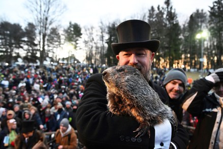 Groundhog Club handler A.J. Dereume holds Punxsutawney Phil, the weather prognosticating groundhog, during the 136th celebration of Groundhog Day on Gobbler's Knob in Punxsutawney, Pa., . Phil's handlers said that the groundhog has forecast six more weeks of winter
Groundhog Day, Punxsutawney, United States - 02 Feb 2022