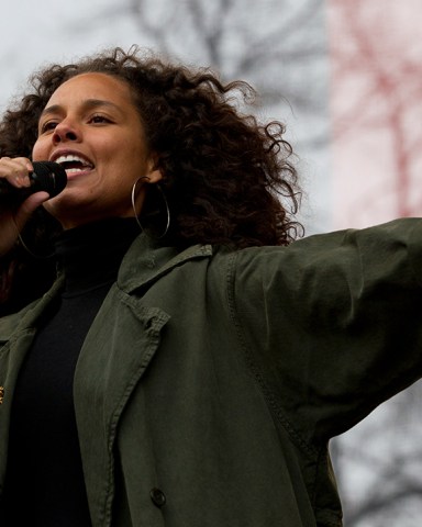 Alicia Keys performs on stage during the women's march rally, in Washington. Organizers of the Women's March on Washington expect more than 200,000 people to attend the gathering. Other protests are expected in other U.S. cities Trump Womens March, Washington, USA - 21 Jan 2017