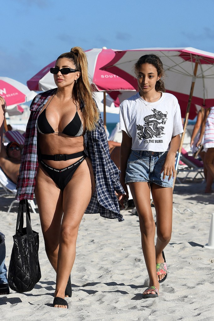 Larsa Pippen wears a black bikini as she hits the beach with her daughter Sophia in Miami