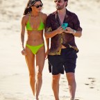 Scott Disick and a mystery brunette girl strolling one the beach during holidays season in St-Barts