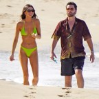 Scott Disick and a mystery brunette girl strolling one the beach during holidays season in St-Barts