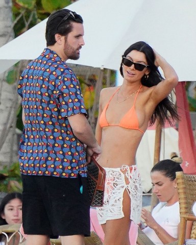 *EXCLUSIVE* Saint-Barthelemy, FRANCE  - Looking relaxed on the beach during his sun-drenched holiday on the Caribbean Island of St Barts, the Reality Star Scott Disick was spotted in the company of the bikini-clad model Bella Banos who bares a striking resemblance to the American Model Kendall Jenner.  Bella got a little touchy-feely with the reality star as she donned her sexy orange bikini, showing off her sexy voluptuous physique in hot the West Indian sunshine.  Pictured: Scott Disick - Bella Banos  BACKGRID USA 22 DECEMBER 2021   BYLINE MUST READ: ELIOT PRESS-MEGA-IMP FEATURES / BACKGRID  USA: +1 310 798 9111 / usasales@backgrid.com  UK: +44 208 344 2007 / uksales@backgrid.com  *UK Clients - Pictures Containing Children Please Pixelate Face Prior To Publication*