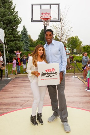 Basketball legend Scottie Pippen stands with his wife Larsa Pippen, left, to announce a partnership with Chicago pizza company Giordano's as it expands with its first North Shore location in Glenview, Ill., on Scottie Pippen Partners with Giordano's in Chicago's North Shore, Glenview, USA