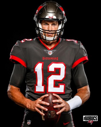 Tom Brady is seen for the first time in his new Tampa Bay Buccaneers uniform.  The 42-year-old NFL quarterback is now playing for a new team in a number 12 jersey, after 20 years with the New England Patriots.  Brady is expected to join other Buccaneers including wide receivers Mike Evans and Chris Godwin and tight ends Rob Gronkowski, OJ Howard and Cameron Brate.  During his two decades with the New England Patriots, Brady won six Super Bowl titles and three NFL MVPs, was named to the Pro Bowl 14 times, and was a three-time First-Team All-Inclusive selection. Pro.  June 16, 2020 Pictured: Tom Brady is seen in his Tampa Bay Buccaneers uniform for the first time.  Photo Credit: Tampa Bay Buccaneers/ MEGA TheMegaAgency.com +1 888 505 6342 (Mega Agency TagID: MEGA681209_003.jpg) [Photo via Mega Agency]
