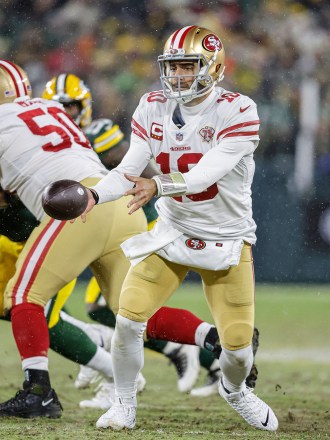 San Francisco 49ers quarterback Jimmy Garoppolo (10) pitches the ball during an NFL divisional playoff football game against the Green Bay Packers, Saturday, Jan 22. 2022, in Green Bay, Wis
49ers Packers Football, Green Bay, United States - 23 Jan 2022