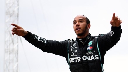 Mercedes driver Lewis Hamilton of Britain celebrates after winning the Turkish Formula One Grand Prix at the Istanbul Park circuit racetrack in Istanbul, Sunday, Nov. 15, 2020. (Clive Mason/Pool via AP)