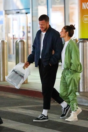 Los Angeles, CA  - *EXCLUSIVE*  - Actress Minka Kelly can't help but smile while walking alongside boyfriend Dan Reynolds as the couple touches down at LAX.Pictured: Minka Kelly, Dan ReynoldsBACKGRID USA 18 FEBRUARY 2023 BYLINE MUST READ: The Daily Stardust / BACKGRIDUSA: +1 310 798 9111 / usasales@backgrid.comUK: +44 208 344 2007 / uksales@backgrid.com*UK Clients - Pictures Containing ChildrenPlease Pixelate Face Prior To Publication*