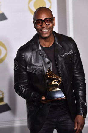 Dave Chappelle poses in the press room with the best comedy album award for "The Age of Spin" and "Deep in the Heart of Texas" at the 60th annual Grammy Awards at Madison Square Garden, in New York
60th Annual Grammy Awards - Press Room, New York, USA - 28 Jan 2018