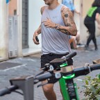 EXCLUSIVE: *NO WEB UNTIL 2330 BST 1ST AUG* Harry Styles sports new facial hair while jogging in Rome