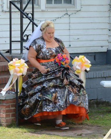 Honey Boo Boo's Mama June Shannon gets married to Sugar Bear in Georgia. June Shannon weds Sugar Bear in a redneck wedding in the country of Atlanta outside their home. The groomsmen wore camo wedding attire.

Pictured: Honey Boo Boo's Mama June Shannon marries Sugar Bear
Ref: SPL534125 050513 NON-EXCLUSIVE
Picture by: SplashNews.com

Splash News and Pictures
USA: +1 310-525-5808
London: +44 (0)20 8126 1009
Berlin: +49 175 3764 166
photodesk@splashnews.com

World Rights