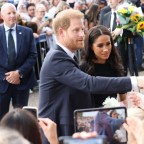 Prince and Princess of Wales along with Prince Harry and Meghan Markle the Duke and Duchess of Sussex looking at Floral Tributes and meeting well wishers at Windsor Castle