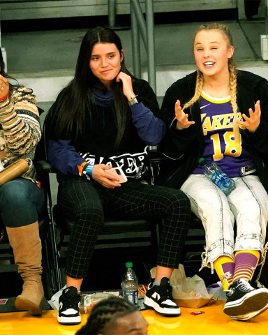 Mandatory Credit: London Entertainment/Shutterstock Mandatory Credit: Photo by London Entertainment/Shutterstock (12655315g) JoJo Siwa and a friend are spotted as The Phoenix Suns play the Los Angeles Lakers at Staples Center Jojo Siwa spotted as The Phoenix Suns play the Los Angeles Lakers at Staples Center, Los Angeles, California, USA - 21 Dec 2021