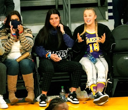 Mandatory Credit: London Entertainment/Shutterstock Mandatory Credit: Photo by London Entertainment/Shutterstock (12655315g) JoJo Siwa and a friend are spotted as the Phoenix Suns play against the Los Angeles Lakers at Staples Center Jojo Siwa spotted as the Phoenix Suns play against the Los Angeles Lakers at Staples Center, Los Angeles, California, USA - Dec 21  2021