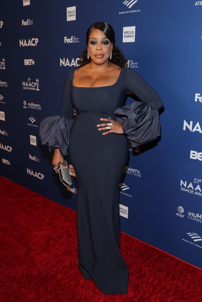 Niecy Nash oozed old Hollywood glamour in a full-length gown with puffy sleeves.