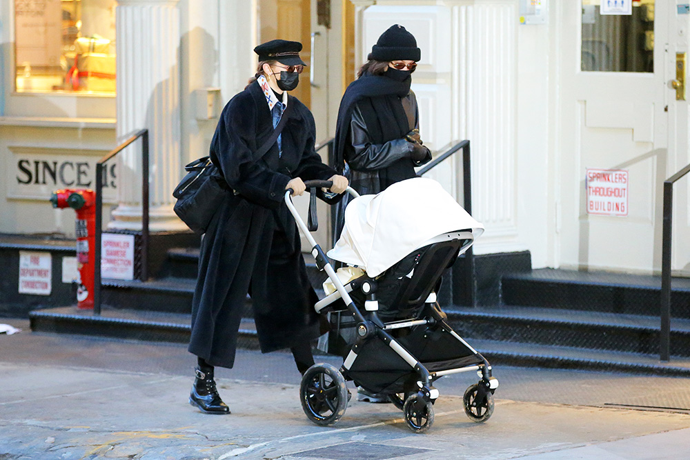 Sisters Gigi And Bella Hadid Walk Through Soho With Gigi‚Äôs Newborn Daughter In A Stroller In New York City