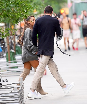 Singer Ariana Grande and actor and comedian Pete Davidson were spotted out together in New York, USA.  The couple went shopping at Whole Foods accompanied by a large bodyguard. Ariana left her pants at home, opting only for an over-sized grey sweater and her signature thigh high boots. Pete stuck up the middle finger as the couple walked back to their apartment.

Pictured: Ariana Grande,Pete Davidson
Ref: SPL5006088 240618 NON-EXCLUSIVE
Picture by: 247PAPS.TV / SplashNews.com

Splash News and Pictures
Los Angeles: 310-821-2666
New York: 212-619-2666
London: 0207 644 7656
Milan: +39 02 4399 8577
photodesk@splashnews.com

World Rights, No Portugal Rights
