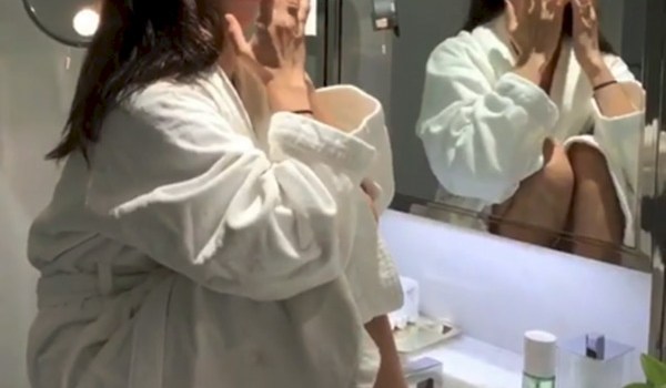 Bella Hadid Using Face Oils In Her Bathrobe