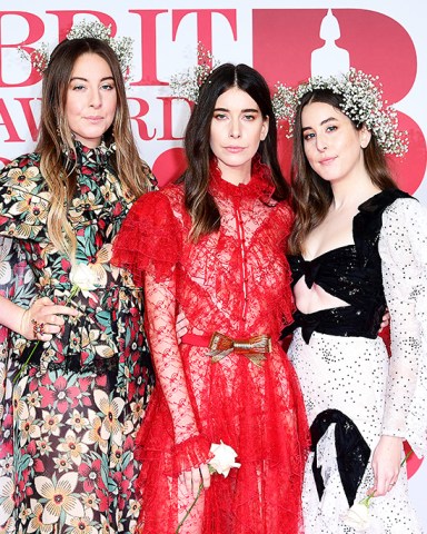 Brit Awards 2018 - Arrivals - London. HAIM's Este Haim, Danielle Haim and Alana Haim attending the Brit Awards at the O2 Arena, London. Picture date: Wednesday February 21, 2018. See PA story SHOWBIZ Brits. Photo credit should read: Ian West/PA Wire URN:35139333