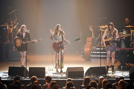 Alana Haim, from left, Danielle Haim, Este Haim of Haim perform onstage at the 2018 MusiCares Person of the Year tribute honoring Fleetwood Mac at the Radio City Music Hall on Friday, Jan. 26, 2018 in New York. (Photo by Evan Agostini/Invision/AP)'