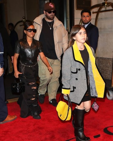 New York, NY  - North West, Penelope & Scott Disick step out in the rain in NYC all dressed in Chanel.  Pictured: Scott Disick, North West, Penelope Disick  BACKGRID USA 30 APRIL 2023   USA: +1 310 798 9111 / usasales@backgrid.com  UK: +44 208 344 2007 / uksales@backgrid.com  *UK Clients - Pictures Containing Children Please Pixelate Face Prior To Publication*