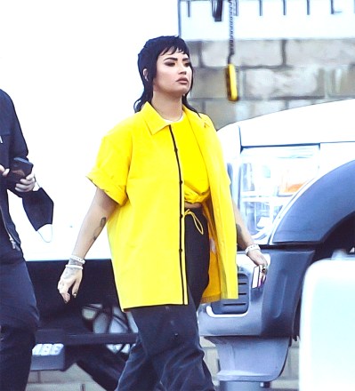 EXCLUSIVE: Demi Lovato was spotted sporting A Funky New Mullet While on the set of a music video of an unreleased song with Rapper G-Eazy in Los Angeles, CA. 09 Jun 2021 Pictured: Demi Lovato. Photo credit: @CelebCandidly / MEGA TheMegaAgency.com +1 888 505 6342 (Mega Agency TagID: MEGA761267_001.jpg) [Photo via Mega Agency]