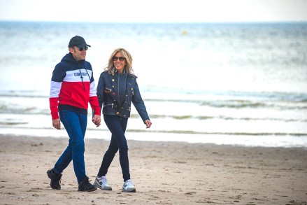 French President and candidate for re-election Emmanuel Macron (R) and his wife Brigitte Macron (L) walk on the beach of Le Touquet, France, 23 April 2022. Macron will face French far-right Rassemblement National (RN) party candidate Marine Le Pen in the second round of the presidential elections on 24 April 2022.
Emmanuel Macron in Le Touquet, France - 23 Apr 2022