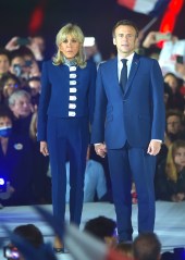France's centrist incumbent president Emmanuel Macron stands with his wife Brigitte Macron after he beats his far-right rival Marine Le Pen for a second five-year term as president on April 24, 2022 in Paris
Emmanuel Macron re-elected as French President, Paris, France - 24 Apr 2022