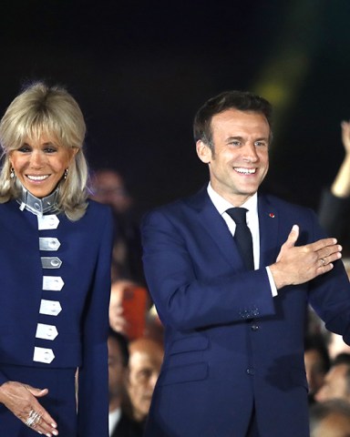 French President Emmanuel Macron and his wife Brigitte Macron celebrate on the stage after winning the second round of the French presidential elections at the Champs-de-Mars in Paris, France, 24 April 2022. Emmanuel Macron defeated Marine Le Pen in the final round of France's presidential election, with exit polls indicating that Macron is leading with approximately 58 percent of the vote.
Second round of the 2022 French presidential election, Paris, France - 24 Apr 2022