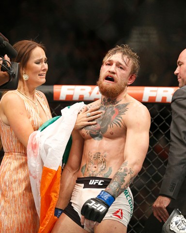 Conor McGregor celebrates with girlfriend Dee Devlin after defeating Chad Mendes during their interim featherweight title mixed martial arts bout at UFC 189, in Las Vegas
UFC 189 Mixed Martial Arts, Las Vegas, USA