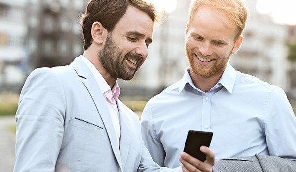 Men Laughing At Cellphone