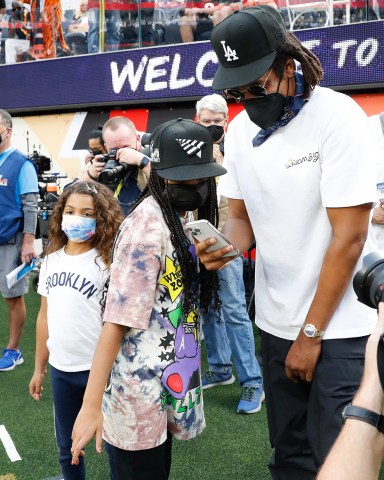 Rapper and producer Jay-Z (R) chats with his daughter Blue Ivy Carter while on the field before the start of Super Bowl LVI  between the Cincinnati Bengals and the Los Angeles Rams at SoFi Stadium in Los Angeles on Sunday, February 13, 2022. Super Bowl Lvi, Los Angeles, California, United States - 13 Feb 2022