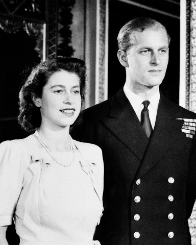 Britain's Princess Elizabeth and her fiance Lieut. Philip Mountbatten pose for camera on September 17, 1947 in White Drawing Room of Buckingham Palace in London in connection with their wedding.   The royal couple will marry on November 20, 1947.    (AP Photo)