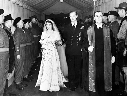 Britain's Princess Elizabeth and her husband the Duke of Edinburgh are seen leaving Westminster Abbey, London, on Nov. 20, 1947, following their wedding service. (AP Photo)