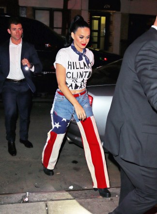 Katy Perry pictured walking into a restaurant after performing at a Hillary Clinton benefit concert at Radio City Music Hall in New York City. She was pictured wearing a t-shirt that says Hillary Clinton is a "bad ass" with jeans that have the american flag design on it. Pictured: Katy PerryRef: SPL1236662 030316 NON-EXCLUSIVEPicture by: SplashNews.comSplash News and PicturesUSA: +1 310-525-5808London: +44 (0)20 8126 1009Berlin: +49 175 3764 166photodesk@splashnews.comWorld Rights