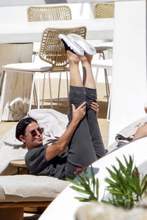 EXCLUSIVE: Demi Moore goes through a rigorous stretching routine to ensure she keeps in shape whilst on holiday on the Greek island of Mykonos. The 58-year-old Ghost actress has not been shy about flaunting her fabulous bikini body while holidaying with her mini-me daughter Rumer, 32, Scout, 29, and Tallulah, 27, whom she had with Bruce Willis, the actor to whom she was married from 1987 to 2000. Demi and her girls are featured in a new campaign for beachwear brand Andie Swim, modeling a variety of swimsuits and bikinis after investing in the brand back in 2018. 14 Jul 2021 Pictured: Demi Moore and Rumer Willis. Photo credit: LONE WOLF / MEGA TheMegaAgency.com +1 888 505 6342 (Mega Agency TagID: MEGA770911_001.jpg) [Photo via Mega Agency]