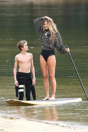 ** RIGHTS: ONLY UNITED STATES, CANADA ** Sydney, AUSTRALIA  - *EXCLUSIVE*  - Elle Macpherson with both of her sons Cy Busson and Flynn Busson are seen during a brand collections advertisement photoshoot. Elle who will turn 55 on March 29 looked amazing as she put her slender legs on display while posing on a paddleboard. The model was in great spirits during the shoot and could be seen having some belly laughs with her son Flynn.Pictured: PhotographerBACKGRID USA 19 MARCH 2019 BYLINE MUST READ: MTRX / BACKGRIDUSA: +1 310 798 9111 / usasales@backgrid.comUK: +44 208 344 2007 / uksales@backgrid.com*UK Clients - Pictures Containing ChildrenPlease Pixelate Face Prior To Publication*