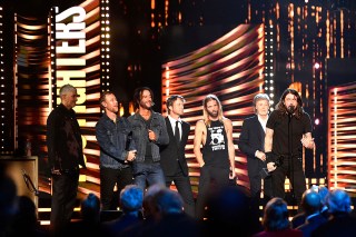 Dave Grohl, right, of the Foo Fighters speaks beside Paul McCartney during the Rock & Roll Hall of Fame induction ceremony, in ClevelandMusic Rock Hall, Cleveland, United States - 31 Oct 2021