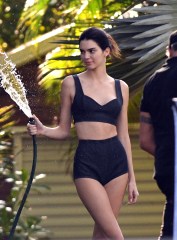 Kendall Jenner wears a black bikini as she plays with a watering hose during a photoshoot in Miami. 05 Feb 2020 Pictured: Kendall Jenner. Photo credit: MEGA TheMegaAgency.com +1 888 505 6342 (Mega Agency TagID: MEGA602702_005.jpg) [Photo via Mega Agency]