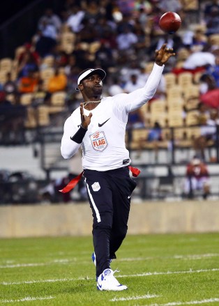 Roadrunners' Michael Vick passes during a semifinal game against Ocho during the American Flag Football League (AFFL) U.S. Open of Football tournament, in Kennesaw, Ga
AFFL U.S. Open Of Football - Semifinals, Kennesaw, USA - 07 Jul 2018