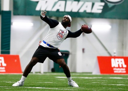 Florida Fury's Michael Vick throws the ball against Fighting Cancer during the American Flag Football League Tournament in Florham Park, N.J
American Flag Football League Tournament - Day 2, Florham Park, USA - 16 Jun 2019