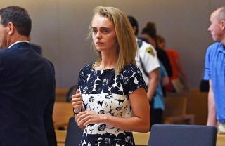 Michelle Carter stands as court is in recess at the end of the day at her trial in Taunton, Mass. Carter is charged with involuntary manslaughter for encouraging Conrad Roy III to kill himself in July 2014. The judge is set to issue a verdict in the case on Friday. (Faith Ninivaggi/The Boston Herald via AP, Pool, File)
Texting suicide case, Taunton, Mass, USA - 12 Jun 2017