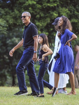 Former U.S. President Barack Obama, left, walks with his wife Michelle, rear right, and daughter Malia, right, upon arrival for a tour at Borobudur Temple in Magelang, Central Java, Indonesia, . Obama and his family wrapped up their five-day vacation on Indonesia's resort island of Bali and headed to the historic city of Yogyakarta on Wednesday during a nostalgic trip to the country where Obama lived for several years as a childObama, Magelang, Indonesia - 28 Jun 2017