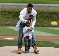 PJ Rose, Derrick Rose PJ Rose gets some final pointers from his dad Derrick Rose before throwing at the first pitch at Wrigley Field before a baseball game between the Pittsburgh Pirates and the Chicago Cubs, in ChicagoPirates Cubs Baseball, Chicago, USA