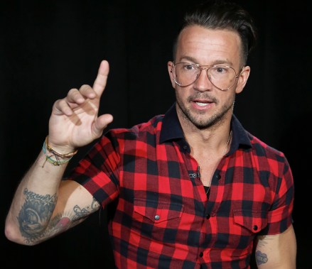 In this Oct. 23, 2017 photo, Carl Lentz, a pastor who ministers to thousands at his Hillsong Church in New York, appears during an interview, in New York. His followers include NBA stars Kyrie Irving, Kevin Durant and popstar Justin Bieber. (AP Photo/Bebeto Matthews)