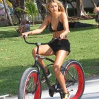 Gigi Hadid taking a ride on a bicycle in Miami Beach