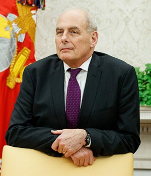 White House Chief of Staff John Kelly watches as President Donald Trump speaks during a signing ceremony for the "Cybersecurity and Infrastructure Security Agency Act," in the Oval Office of the White House, in WashingtonTrump, Washington, USA - 16 Nov 2018