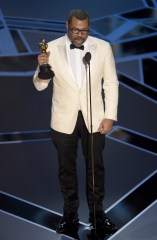 Jordan Peele accepts the award for best original screenplay for "Get Out" at the Oscars, at the Dolby Theatre in Los Angeles
90th Academy Awards - Show, Los Angeles, USA - 04 Mar 2018