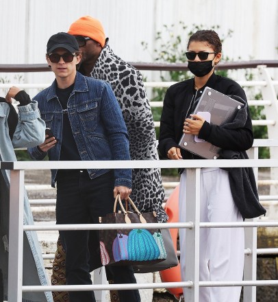 Venice, ITALY  - *EXCLUSIVE*  - Loved-up pair Zendaya and Tom Holland were seen leaving along with Zendaya's stylish Law Roach from Venice Marco Polo Airport after the couple spent a few days of romance in the city of love.

American Actress Zendaya had attended the 