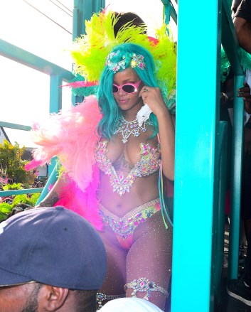 Rihanna was spotted partying hard at Cropover Festival Kadooment Day in Barbados . She looked amazing with a Blue Wig, and a Bejeweled Costume . She wore colorful feather headers as she waved to fans along the parade route. She seemed to be having an amazing time. Lewis Hamilton on the other hand, tried to get on the same float as his rumored ex, and she wanted no part. Him and his crew were forced to walk behind in the middle of the street.

Pictured: Rihanna,Lewis Hamilton,Rihanna
Lewis Hamilton
Ref: SPL1552165 070817 NON-EXCLUSIVE
Picture by: SplashNews.com

Splash News and Pictures
Los Angeles: 310-821-2666
New York: 212-619-2666
London: +44 (0)20 7644 7656
Berlin: +49 175 3764 166
photodesk@splashnews.com

World Rights